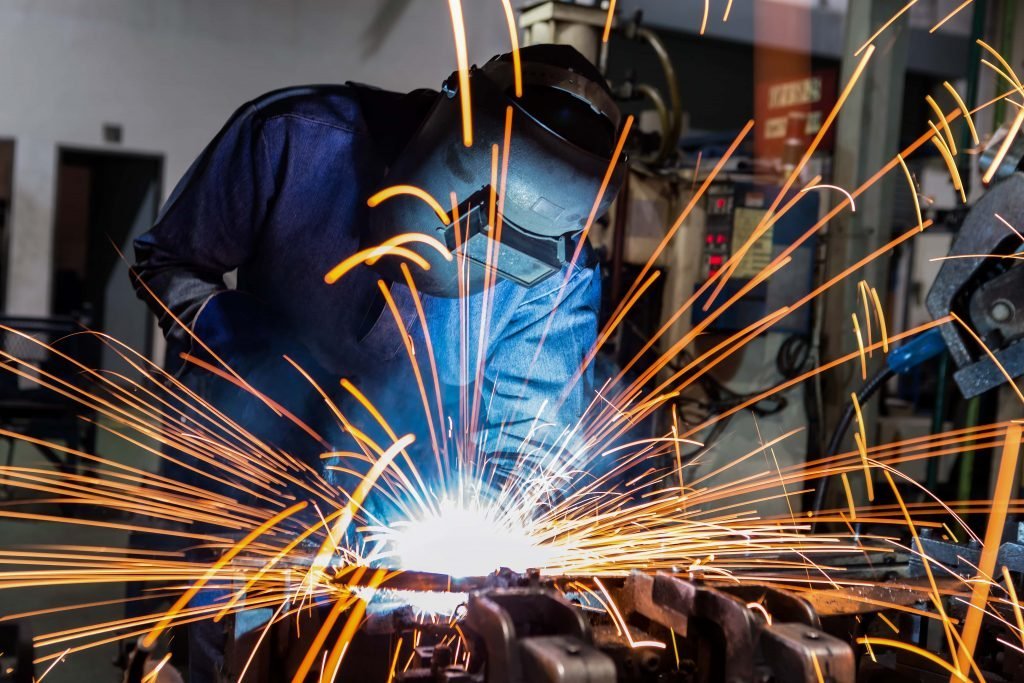 Welder working in a manufacturing workshop